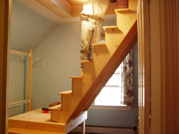 Billy is adding some finish to the attic landing.