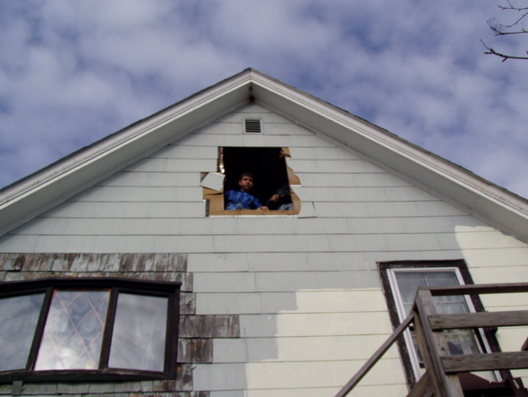 It looks a little rougher from the outside, doesn't it? Oh, in case you're wondering, the problem with the siding around the larger window to the lower left is not as bad as it looks. Whenever that window was put in, they replaced the siding with cedar siding instead of the asbestos siding that was there, and the paint isn't holding up very well. I'll be replacing the cedar siding with something that more closely matches the rest of the house.