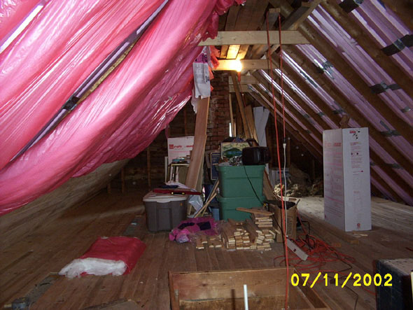 The west side is fully insulated, with part of the wall in place. The other side so far has only the soffit vents.