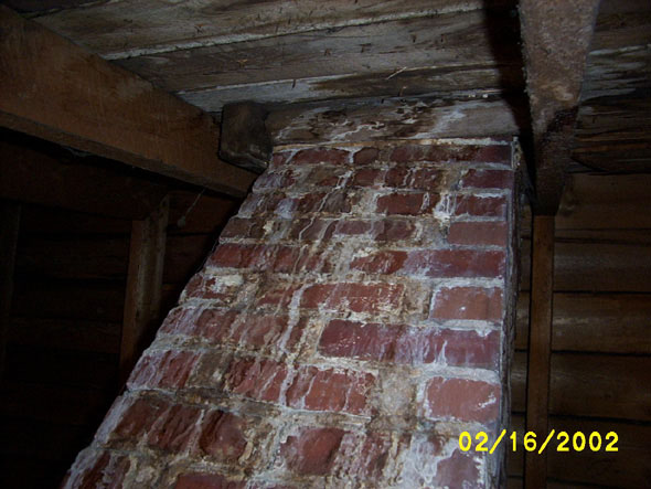 I know.  I keep taking pictures of this chimney.  This is the worst area of damage we have in the attic.  Again, it doesn't seem to have ruined the integrity of the wood itself, and I think I'll be able to correct it in the spring.