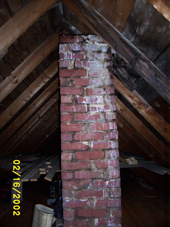 Although it looks ugly in this picture, the wood around the inactive chimney is not at all damaged.  The blackened area is from the chimney itself rather than from water damage.