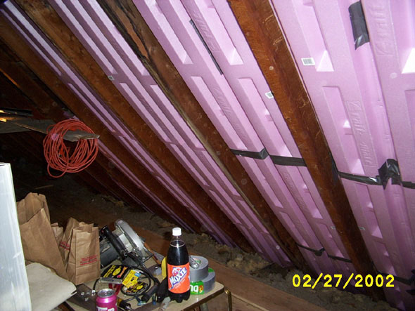 The joists can be seen, although they've mostly been covered by insulation material. The vents are in place throughout the north end of the east wall.
