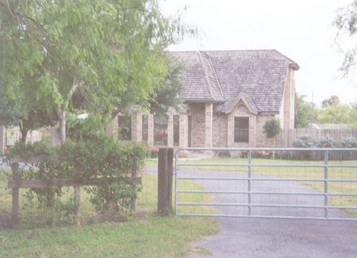 This beautiful and nicely landscaped house can be seen on M 13 1/2-N, east of M 4-W.