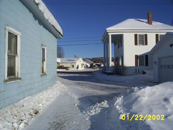 The side of R&D's can be seen on the left, a house on the right, and the post office in the background.