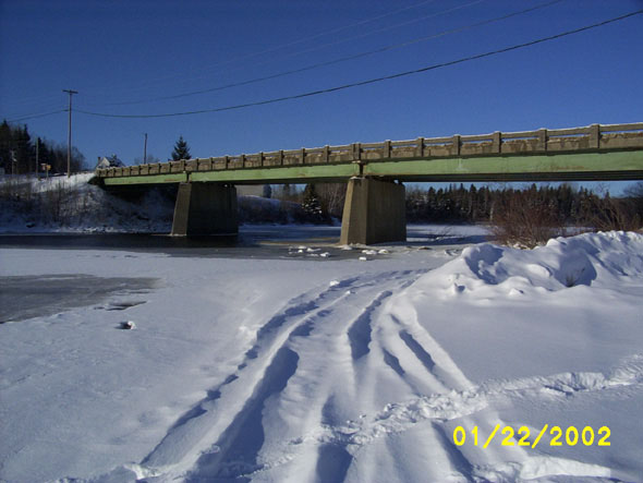 In an unusually warm January, the Fish River is not yet frozen over below the bridge.