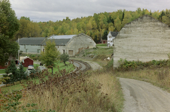 a couple of warehouses along Pond View Road.  The one in the foreground appears to be unuses, while the one in the background is used to store grain.