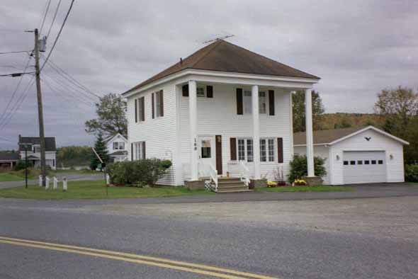 White house on Soldier Pond Road, across from the post office.