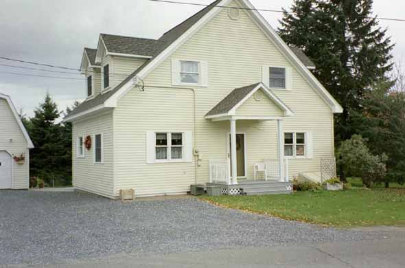 A yellow house on Soldier Pond Road.